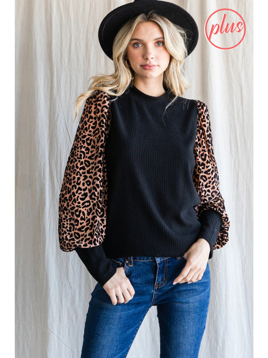 Solid knit top with leopard print sleeves